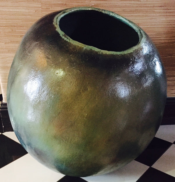 Bronze-green pot, shown in a room for scale