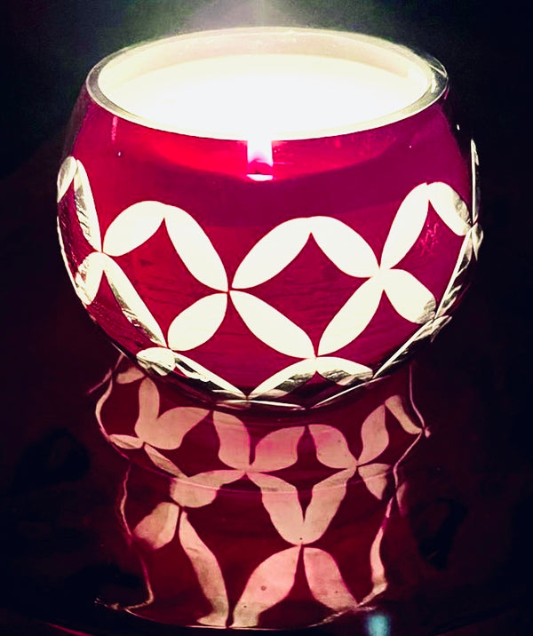 Ruby cut-glass candle, shown in a room for scale