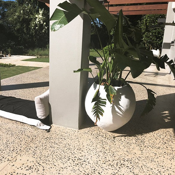Eggshell urn, shown in a room for scale