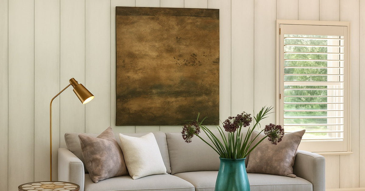 Bronze Horizon above a grey sofa in a light living room