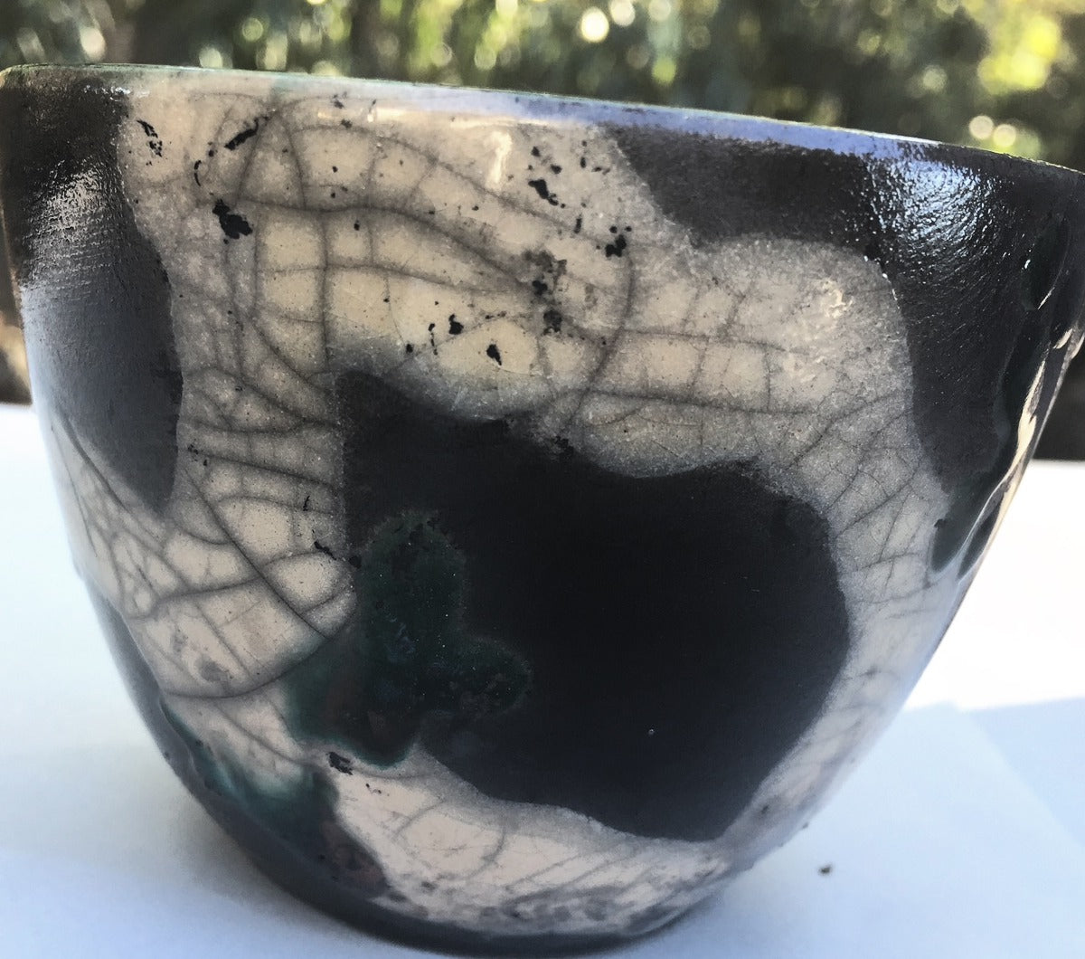 Raku bowl with a black and white crackle glaze